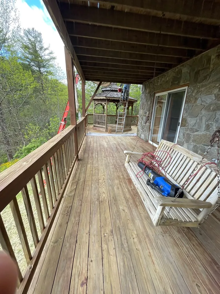 Weathered porch and deck boards before restoration